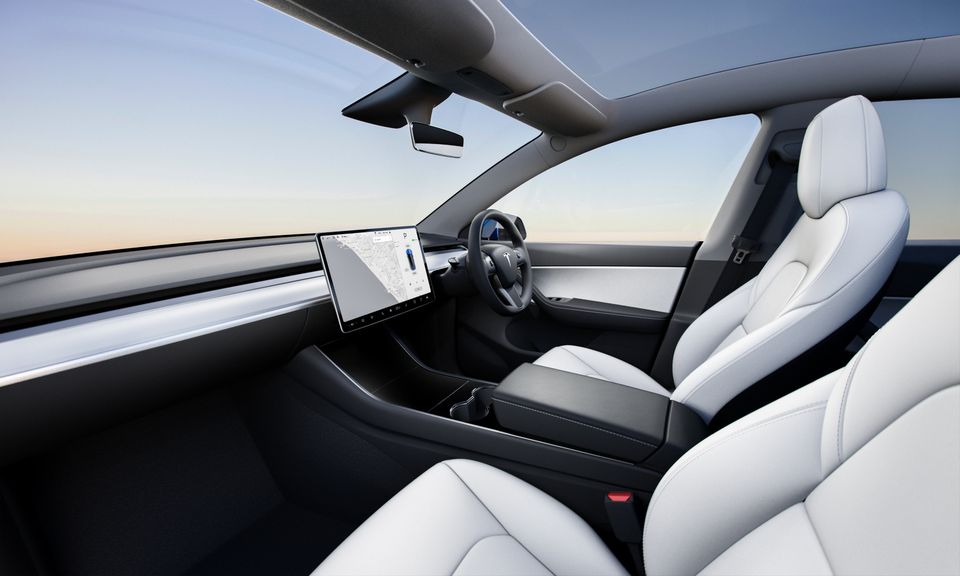Tesla Model Y with it's paired back interior and giant centralised touch screen