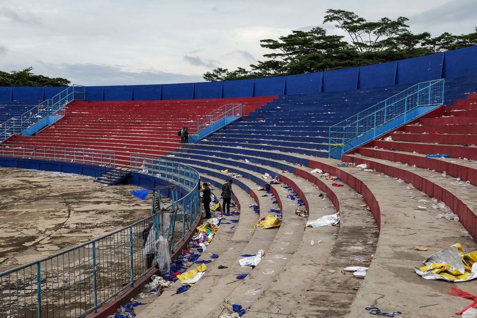 Shoes and belongings left inside the Kanjuruhan Stadium after the pitch invasion and stampede in Malang, Indonesia