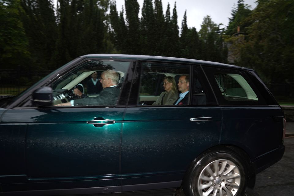 Members of the British royal family travel to the queen's home in the Scottish Highlands