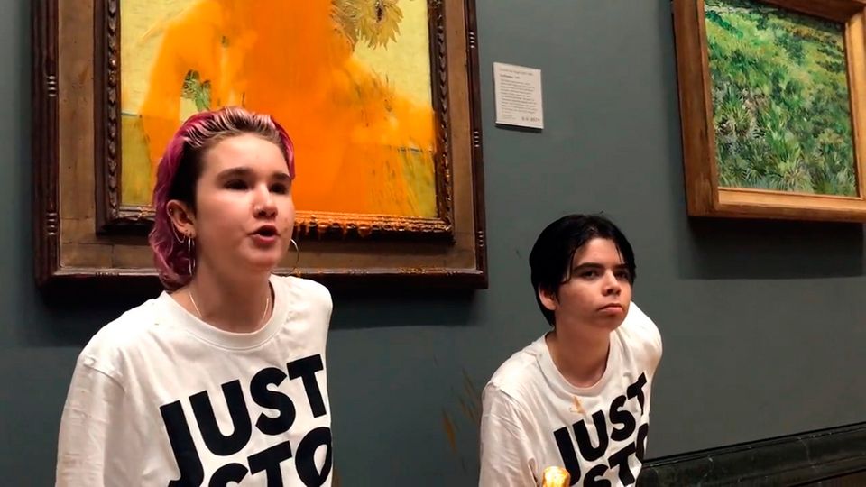 Protest: Two young people who threw tinned soup at Vincent Van Gogh’s famous 1888 work Sunflowers at the National Gallery in London