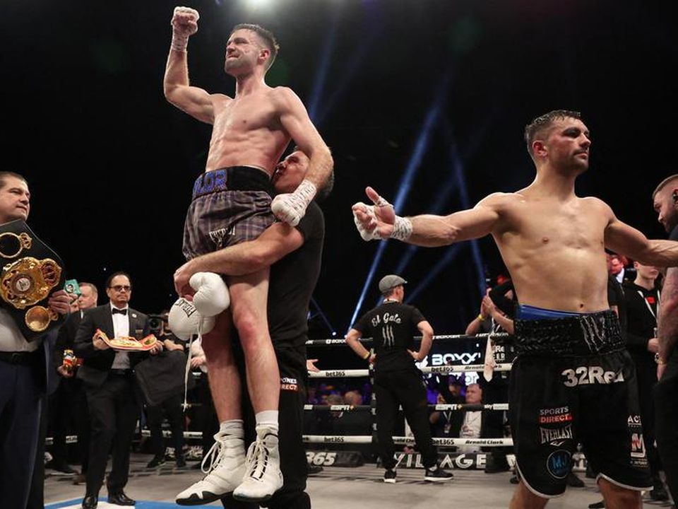 Josh Taylor, left, celebrates winning a controversial fight against Jack Catterall. Credit: Reuters/Lee Smith
