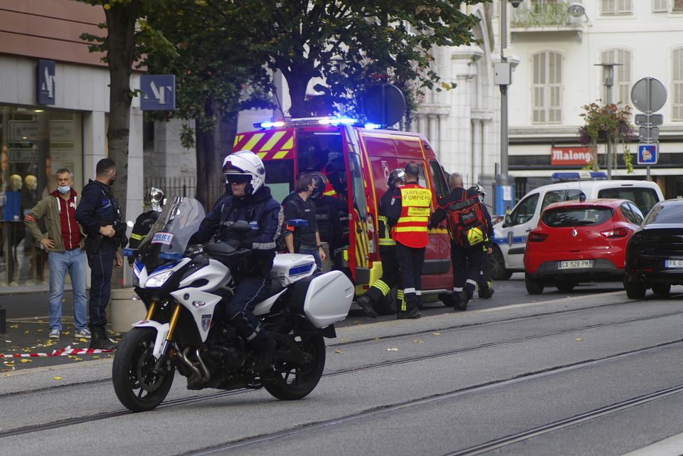 French police and fire officers next to Notre Dame church after a knife attack (Alexis Gilli/AP)