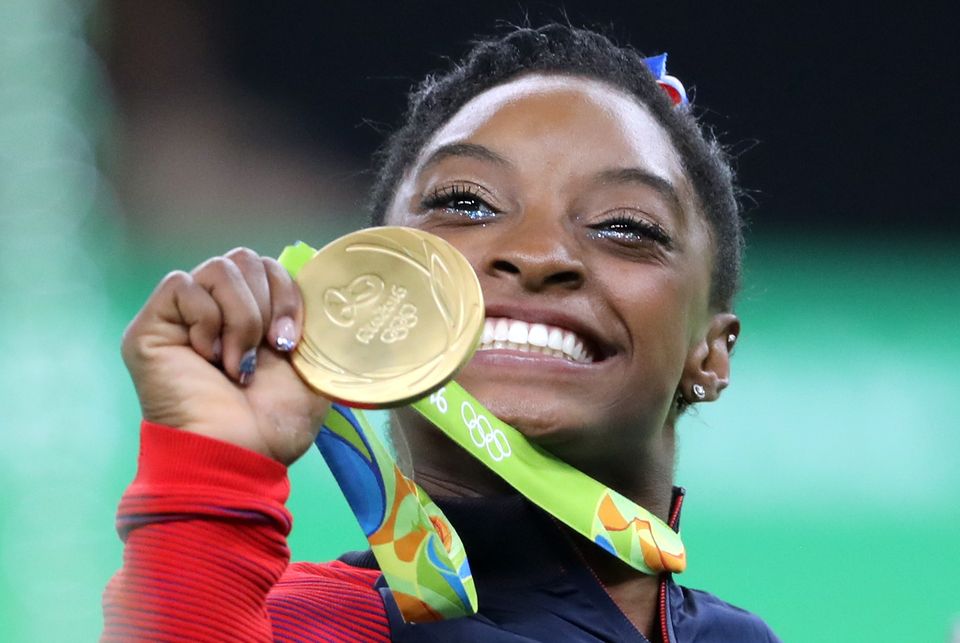 Simone Biles celebrates victory in the Women’s Team Gymnastics final at the Rio Olympic Arena (Owen Humphreys/PA)
