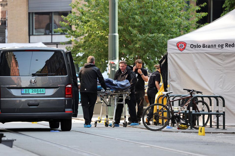 The body of one of the victims is taken from the scene following a shooting at a nightclub in Oslo. Photo: Orn E Borgen/NTB/via Reuters