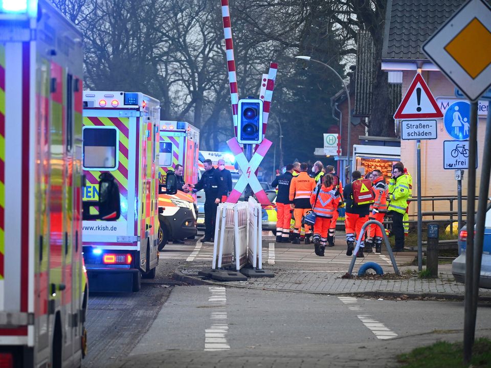 Emergency workers near Brokstedt station, Germany, after several people were injured in a knife attack on a  train from Kiel to Hamburg. Photo: Jonas Walzberg/DPA via AP)