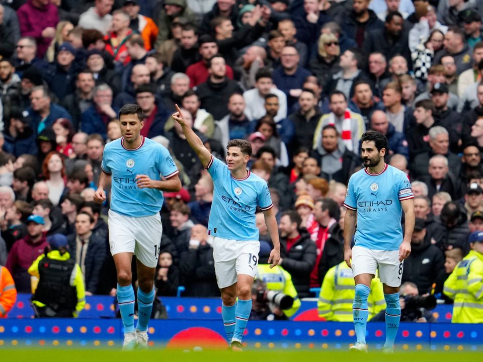 Manchester City's Julian Alvarez, center, celebrates with teammates after scoring his side's first goal during the English Premier League soccer match between Manchester City and Liverpool at Etihad stadium in Manchester, England,Saturday, April 1, 2023. (AP Photo/Jon Super)