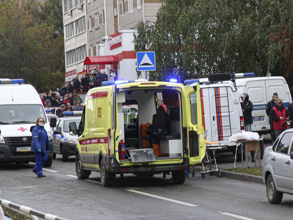 Police and paramedics work at the scene of a shooting at school No. 88 in Izhevsk, Russia, Monday, Sept. 26, 2022. A gunman on Monday morning killed 13 people and wounded 21 others in a school in central Russia, authorities said. Russia's Investigative Committee said in statement that seven children were among those killed in the shooting in the school in Izhevsk, a city about 960 kilometers (596 miles) east of Moscow in the Udmurtia region. (AP Photo)