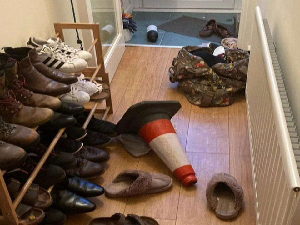 A traffic cone in the hallway of the couple's home after the incident