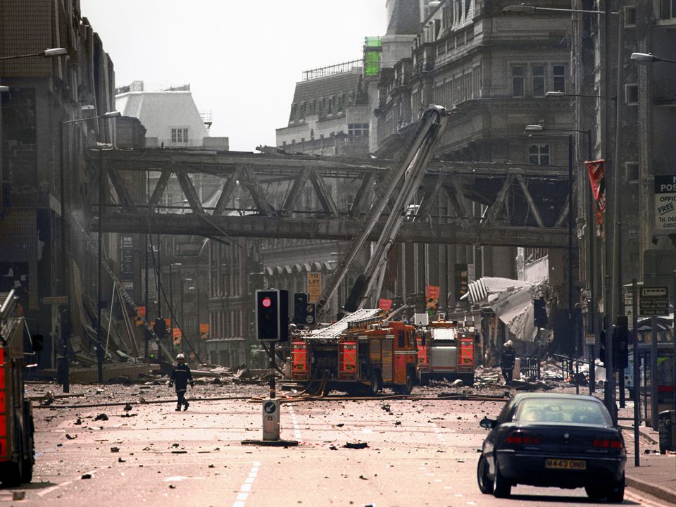 Firemen at the scene of the IRA bomb blast in Manchester city centre in 1996