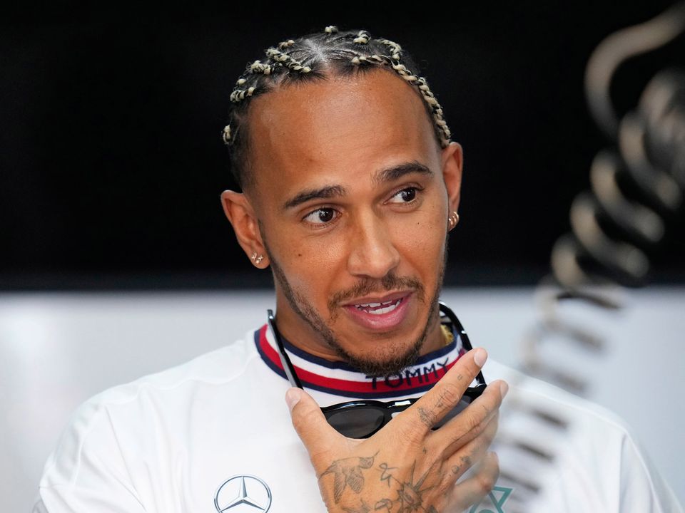 Mercedes driver Lewis Hamilton, of Britain, arrives at pit prior to the start of the first practice for the French Formula One Grand Prix at Paul Ricard racetrack in Le Castellet, southern France, Friday, July 22, 2022. The French Grand Prix will be held on Sunday. (AP Photo/Manu Fernandez)...S