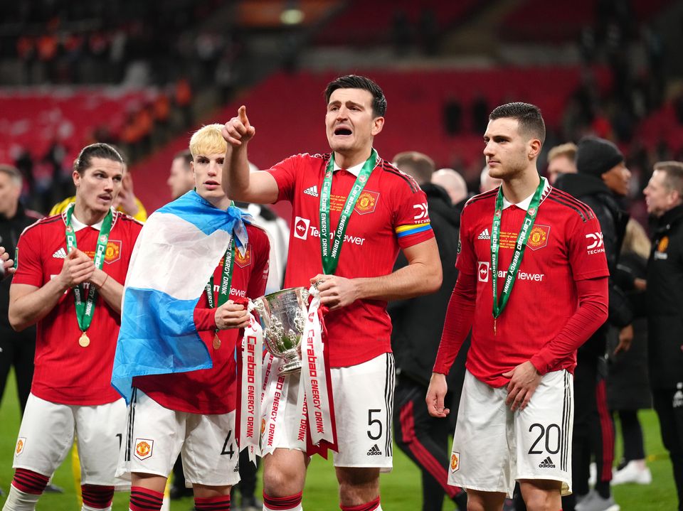 Harry Maguire (centre) is aware of the competition for places in Manchester United’s defence (John Walton/PA)