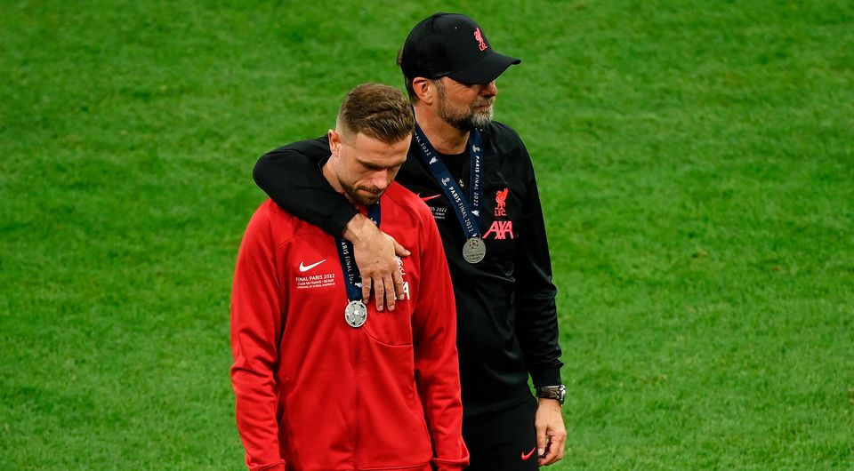 Jurgen Klopp embraces Jordan Henderson of Liverpool after their sides defeat in the UEFA Champions League final. (Photo by Matthias Hangst/Getty Images)