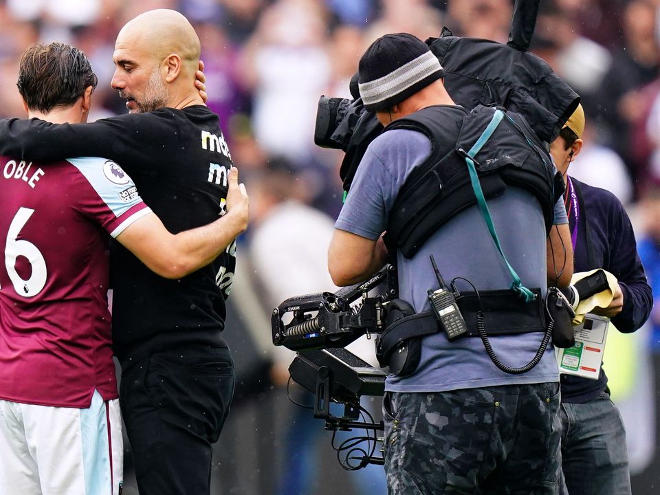 Manchester City manager Pep Guardiola hugs West Ham’s Mark Noble (Adam Davy/PA)