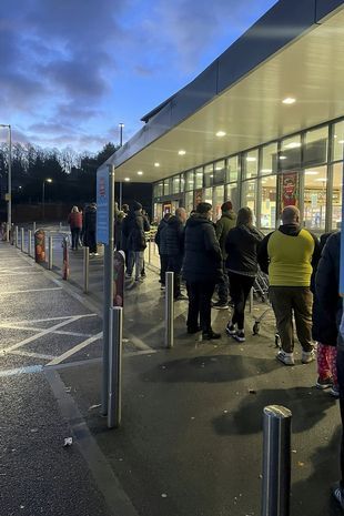 English shoppers wait for Aldi to open so they can buy Prime energy drink