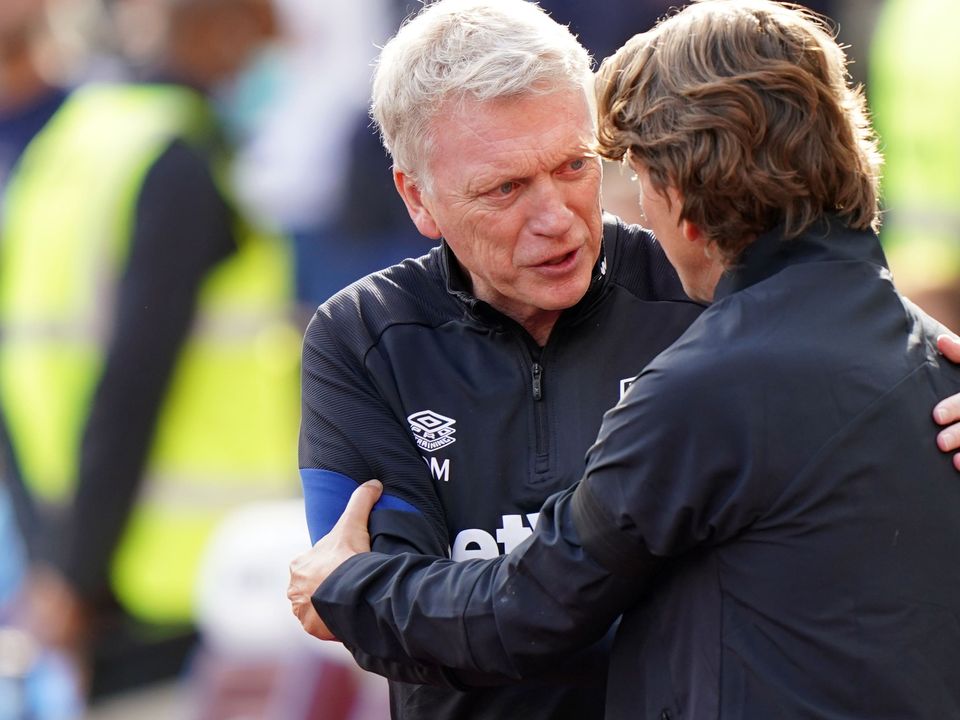 West Ham manager David Moyes, left, is balancing European commitments going into Sunday’s meeting with Thomas Frank’s Brentford (Tim Goode/PA)
