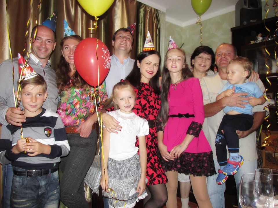 Olena Tytarenko with family and friends in better times when photgraphed in her apartment before the Russian soldiers invaded her home city of Irpin last February. 