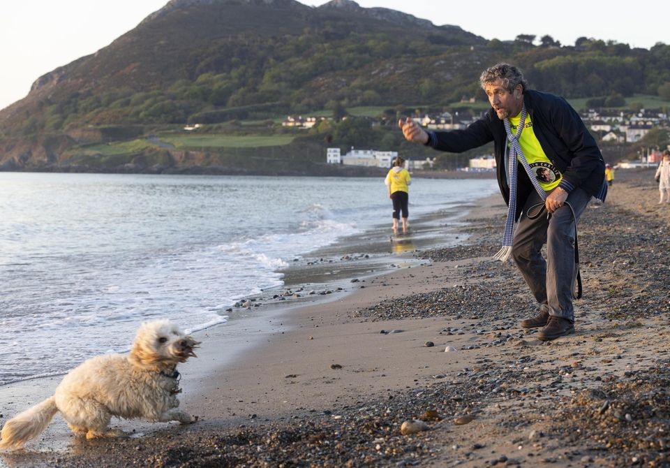 Charlie Bird and his dog Tiger after taking part in Bray's Darkness Into Light walk. Photo: Fergal Phillips