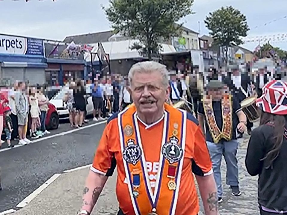 Eddie McIlwaine, a former member of the Shankill Butchers, takes part in Twelfth celebrations