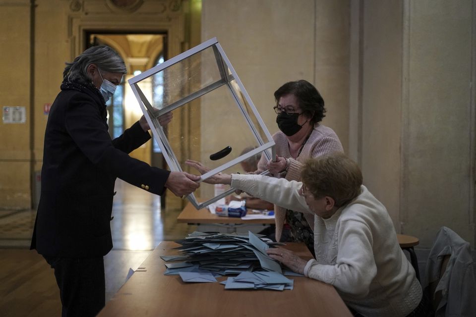 Election officials counting ballots in Lyon, central France (AP Photo/Laurent Cipriani)