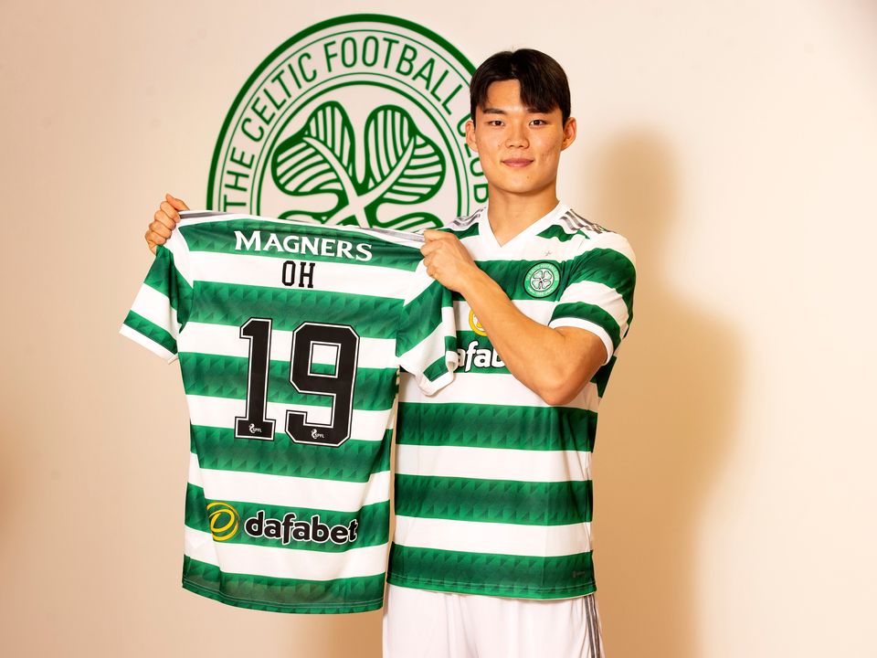 Hyeongyu Oh poses with a jersey as he completes his move to Celtic. Photo: Getty Images