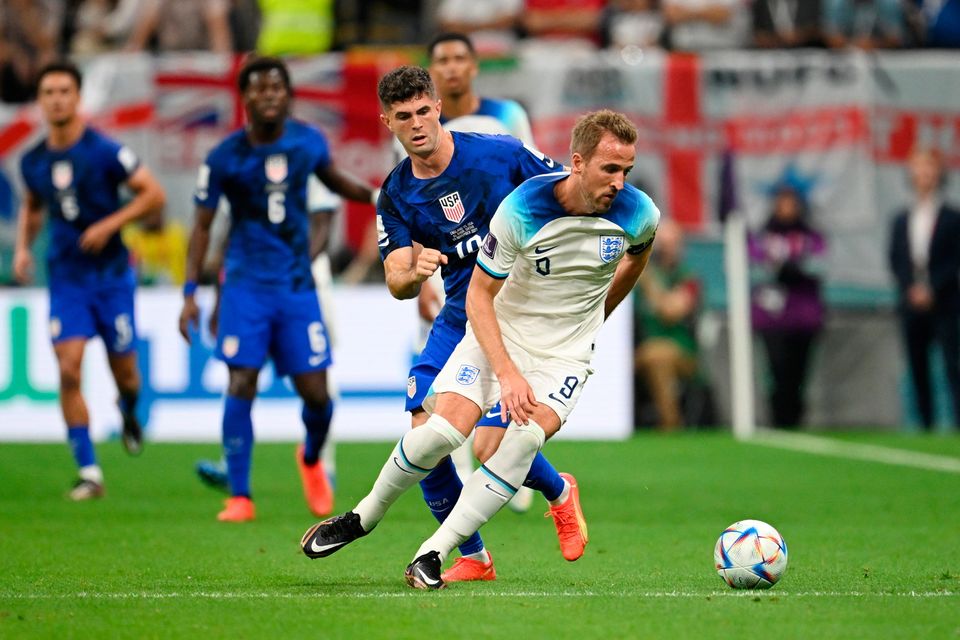 AL KHOR, QATAR - NOVEMBER 25: Harry Kane of England controls the ball against Christian Pulisic of United States during the FIFA World Cup Qatar 2022 Group B match between England and USA at Al Bayt Stadium on November 25, 2022 in Al Khor, Qatar. (Photo by Clive Mason/Getty Images)