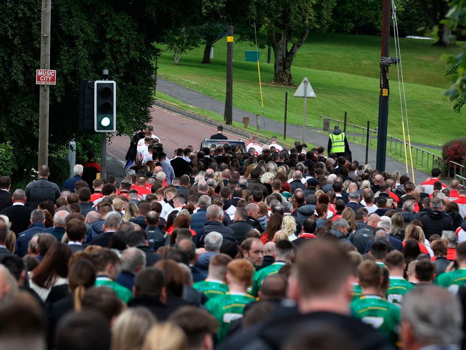 Mourners follow the coffin as it leaves St Patrick's Church, Dungannon, County Tyrone, after the funeral for GAA star Damian Casey, following the death of the Tyrone hurling captain was attending a friend's wedding in Spain when he died in an incident in a swimming pool last week. Picture date: Sunday June 26, 2022. PA Photo. See PA story ULSTER Casey. Photo credit should read: Liam McBurney/PA Wire