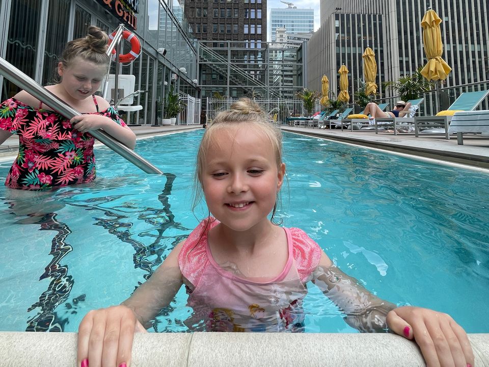 Charlie and sister Billie May taking a dip in the rooftop pool at Margaritaville Resort Times Square