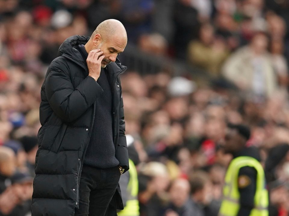 Manchester City's head coach Pep Guardiola reacts during the English Premier League soccer match between Manchester United and Manchester City at Old Trafford in Manchester, England, Saturday, Jan. 14, 2023. (AP Photo/Dave Thompson)