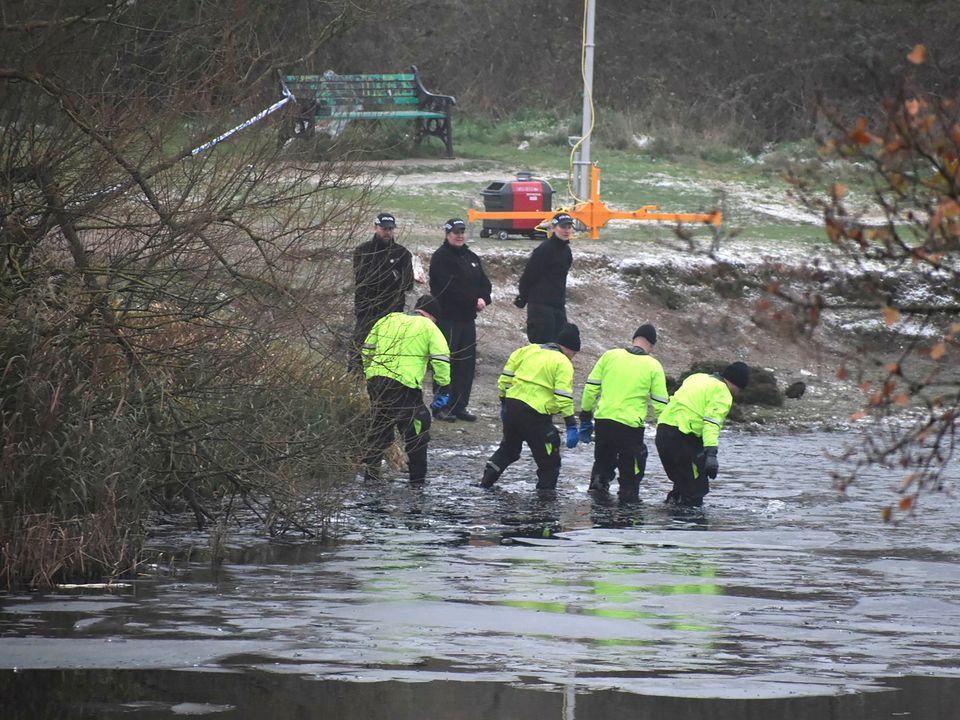 Police search teams at the scene in Babbs Mill Park in Kingshurst, Solihull Photo: Matthew Cooper/PA Wire