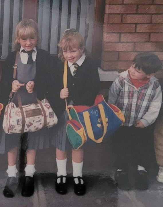 Natalie, centre, with Jayne on their first day at school. Also pictured is Natalie’s brother Niall.