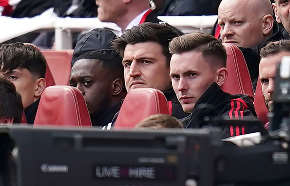 Harry Maguire, centre, was on the bench for United (John Walton/PA)