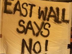 Sign held up by protestors in East Wall