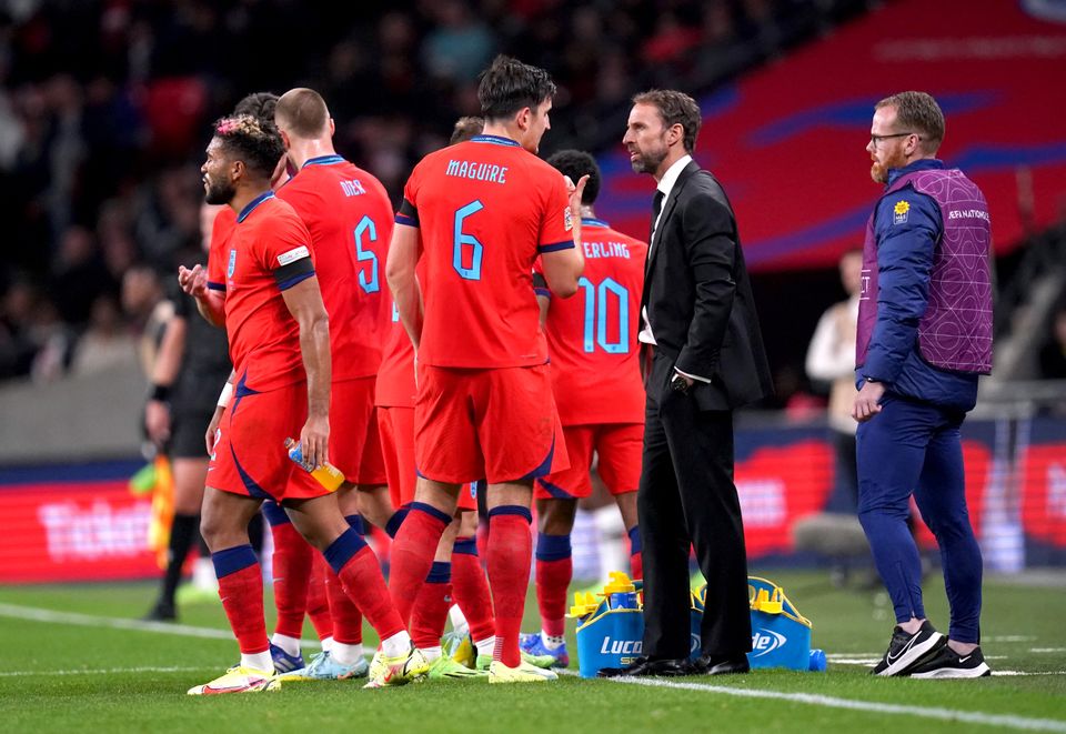 England manager Gareth Southgate speaks to Harry Maguire during the UEFA Nations League match at Wembley Stadium, London. Picture date: Monday September 26, 2022.
