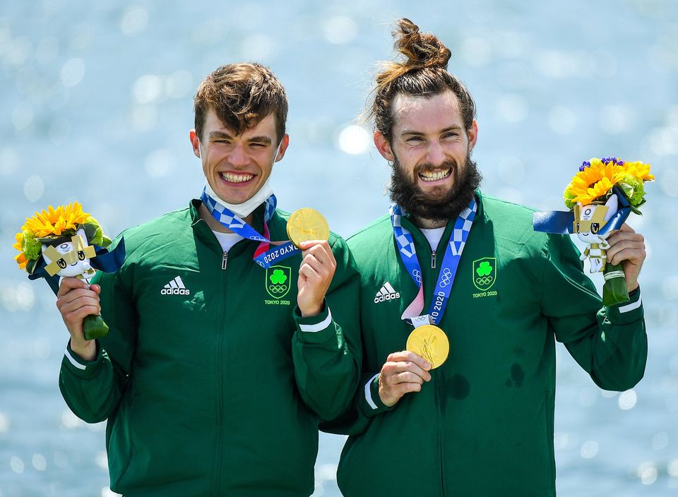 Fintan McCarthy, left, and Paul O'Donovan celebrate with their Olympic gold medals. Photo by Seb Daly/Sportsfile