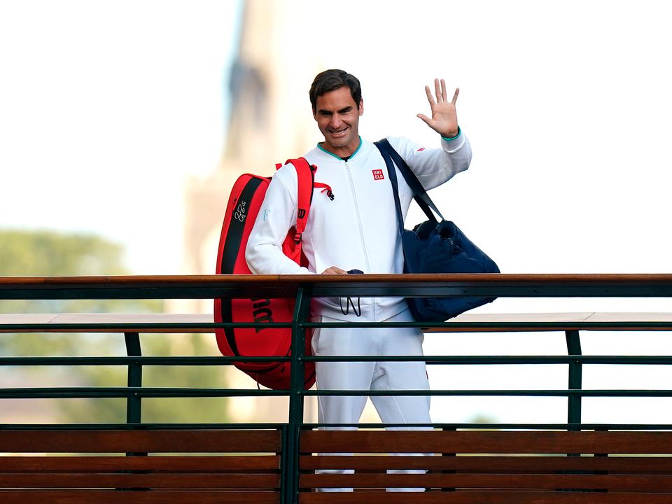 File photo dated 07-07-2021 of Roger Federer waves to the spectators as he walks over the bridge on day nine of Wimbledon at The All England Lawn Tennis and Croquet Club, Wimbledon. Roger Federer has announced he will retire from professional tennis after the Laver Cup. Issue date: Thursday September 15, 2022. PA Photo. See PA story TENNIS Federer.  Photo credit should read Adam Davy/PA Wire.