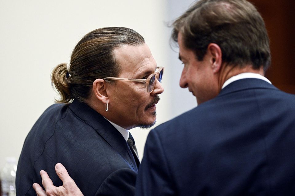 Actor Johnny Depp talks to his attorney during the defamation trial against ex-wife Amber Heard in Fairfax, Virginia. Brendan Smialowski/Reuters