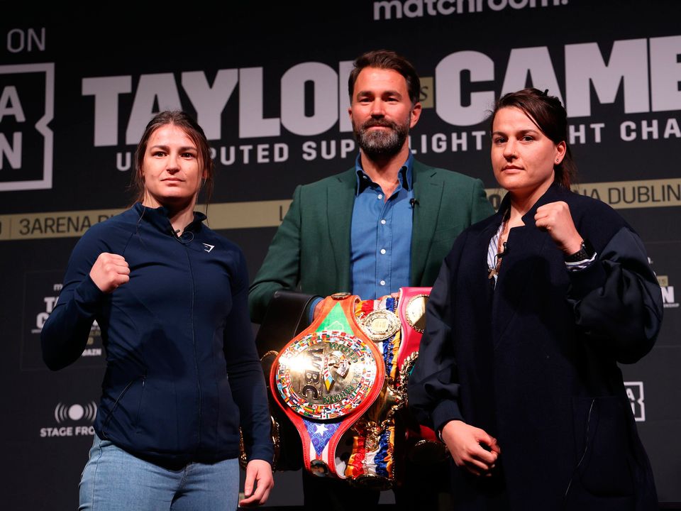 Katie Taylor (left) with Chantelle Cameron as Promoter, Eddie Hearn looks on during a press conference at The Mansion House, Dublin. Picture: Damien Eagers/PA Wire.