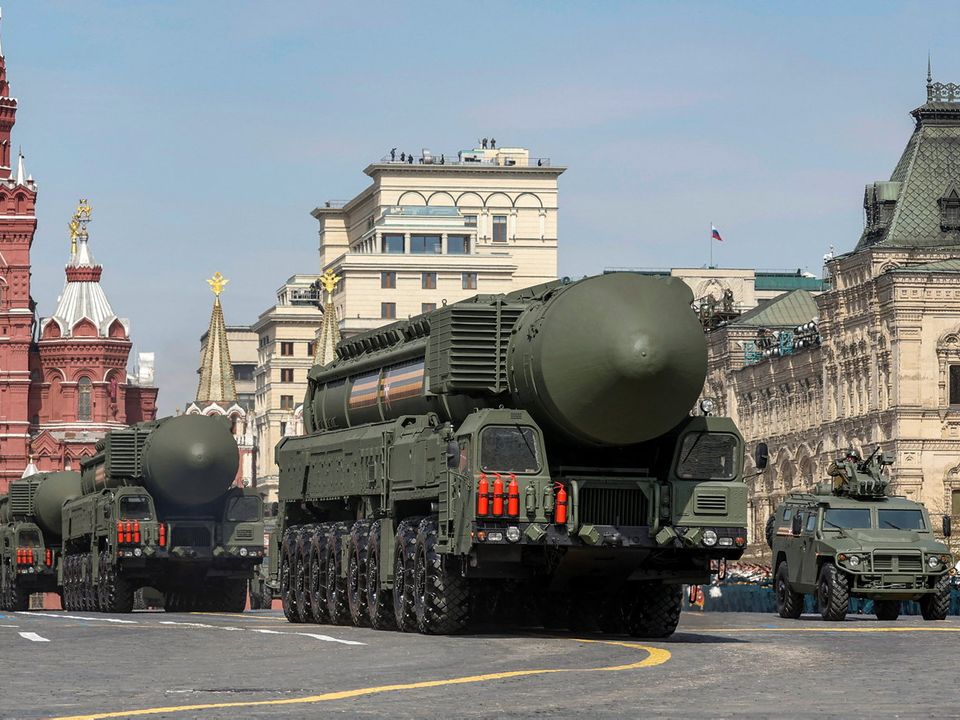 Russian military vehicles, including Yars intercontinental ballistic missile systems, drive in Red Square during rehearsals for Monday's Victory Parade