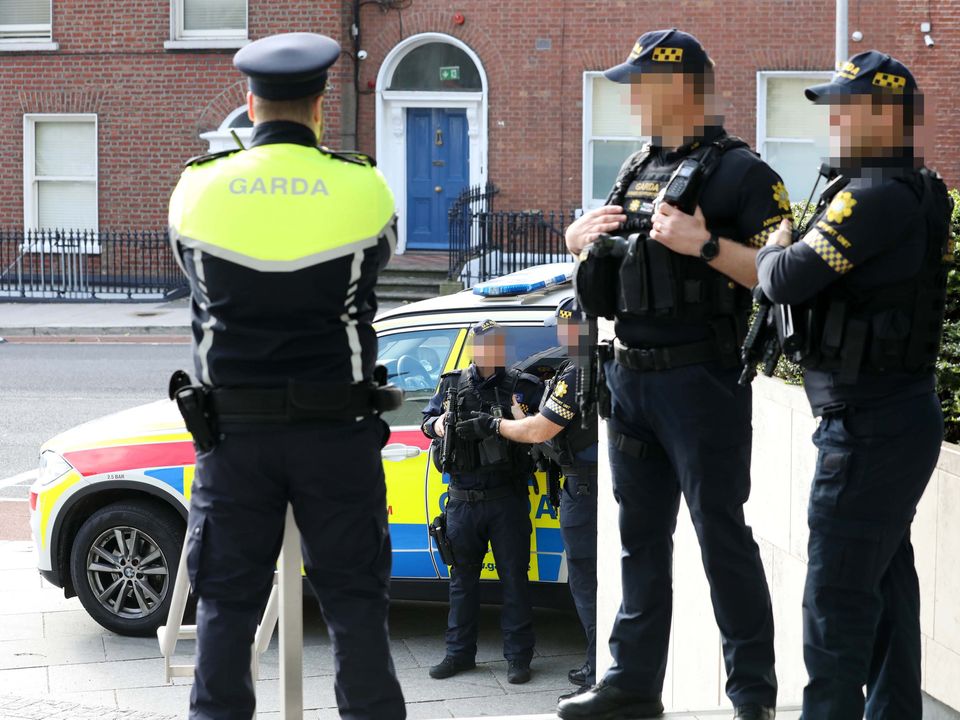 Armed gardaí are in close attendance at the trial