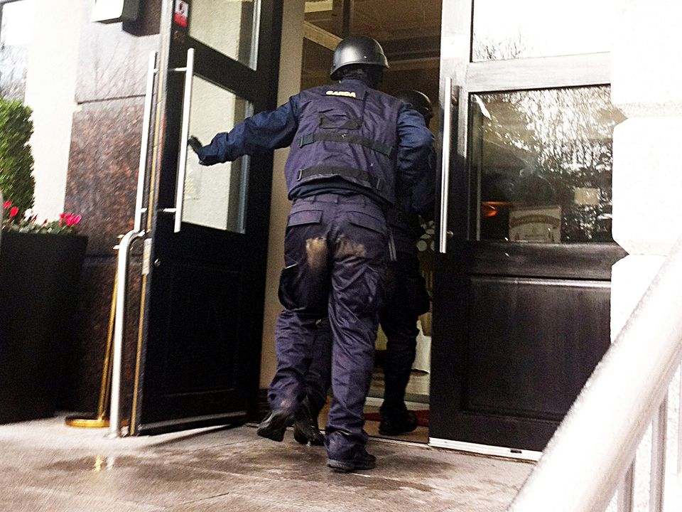 Gunmen disguised as members of the Garda ERU enter the Regency Hotel