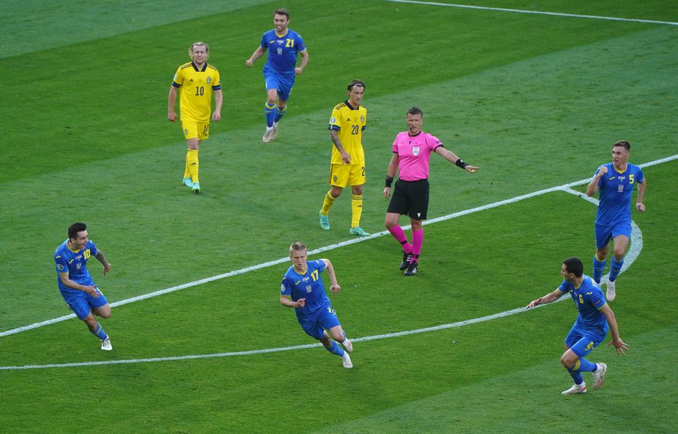 Oleksandr Zinchenko celebrates scoring for Ukraine at Euro 2020 (Andrew Milligan/PA)