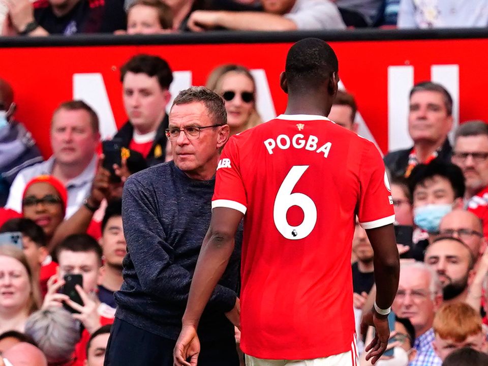 Manchester United manager Ralf Rangnick greets Paul Pogba as he leaves the field of play. Photo: Martin Rickett/PA