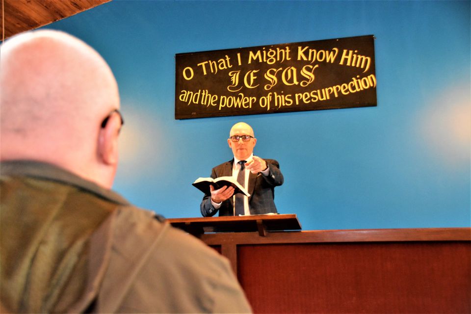 Pastor Halliday in his mission hall with Sunday World’s Hugh Jordan