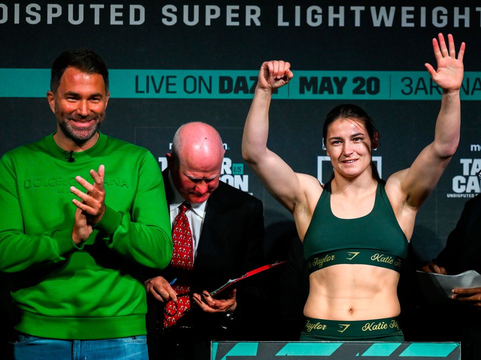 Katie Taylor and promoter Eddie Hearn during the weigh-in at the Mansion House in Dublin. Photo: Sportsfile