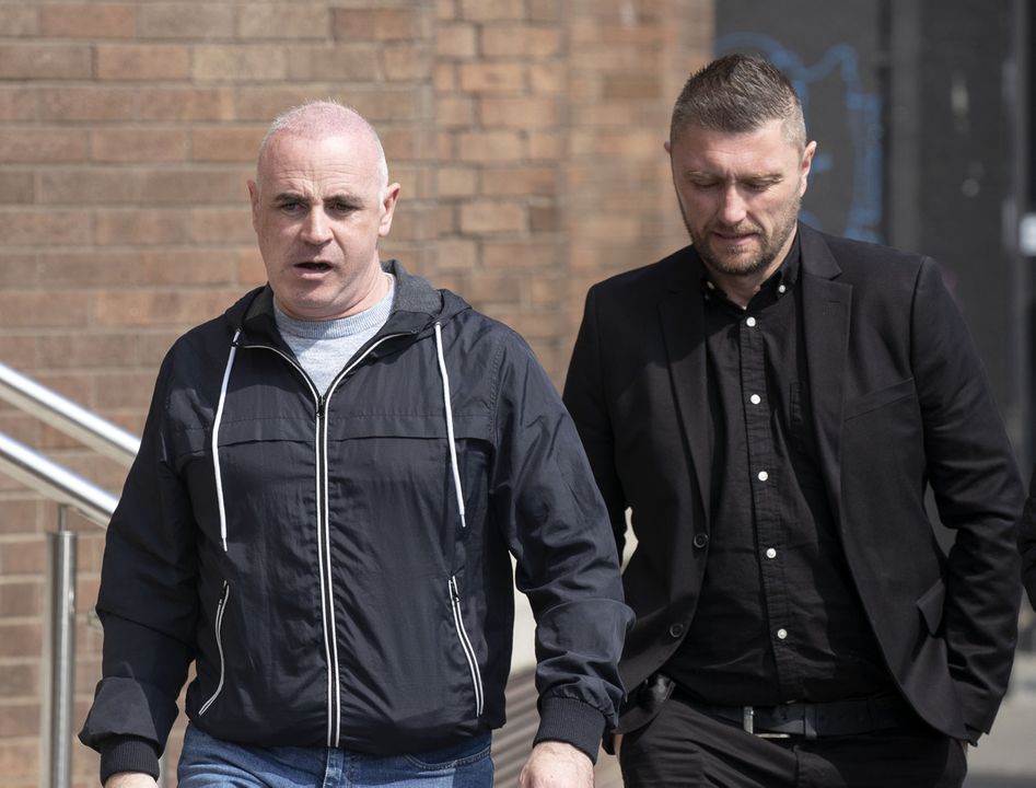 Luas tram driver and mentor, Wayne Clifford, left and tram driver, Robert O'Neill pictured leaving the Dublin District Coroner's Court after giving evidence to the inquest into the death of 71 year old Patricia Quinn