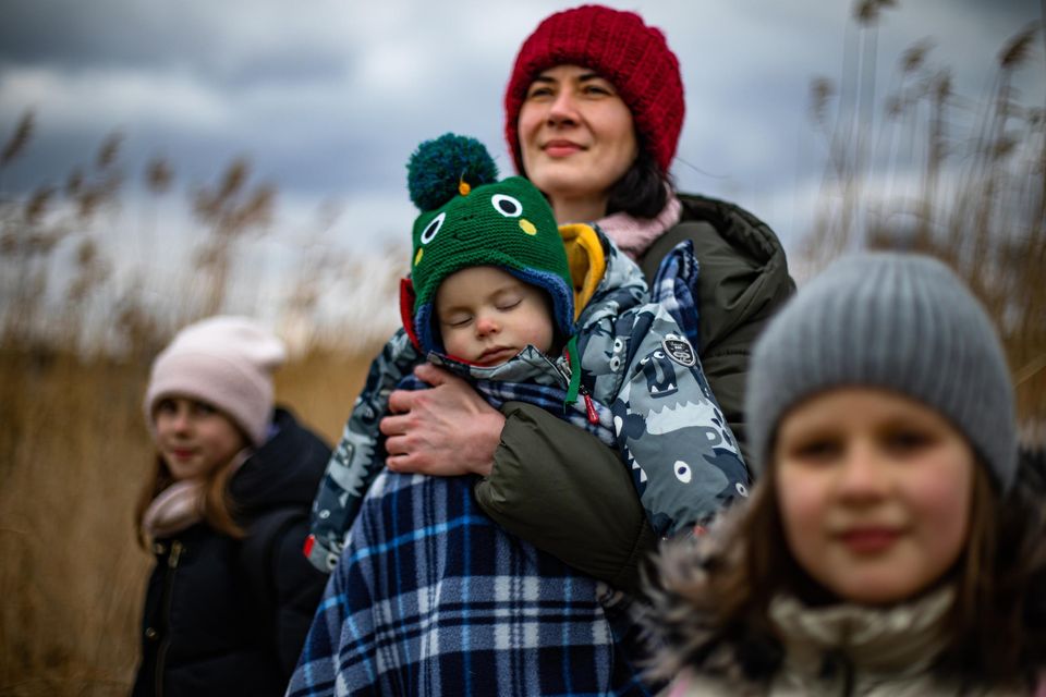 Refugee Olena Savkova with her children Ellie (10) Kristie (7) and Misha (10 months) from the cityh of Dnipro in Ukraine who crossed the border to Poland (Photo: Mark Condren)