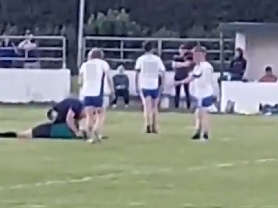The referee lies on the ground after an alleged assault during a match in Roscommon