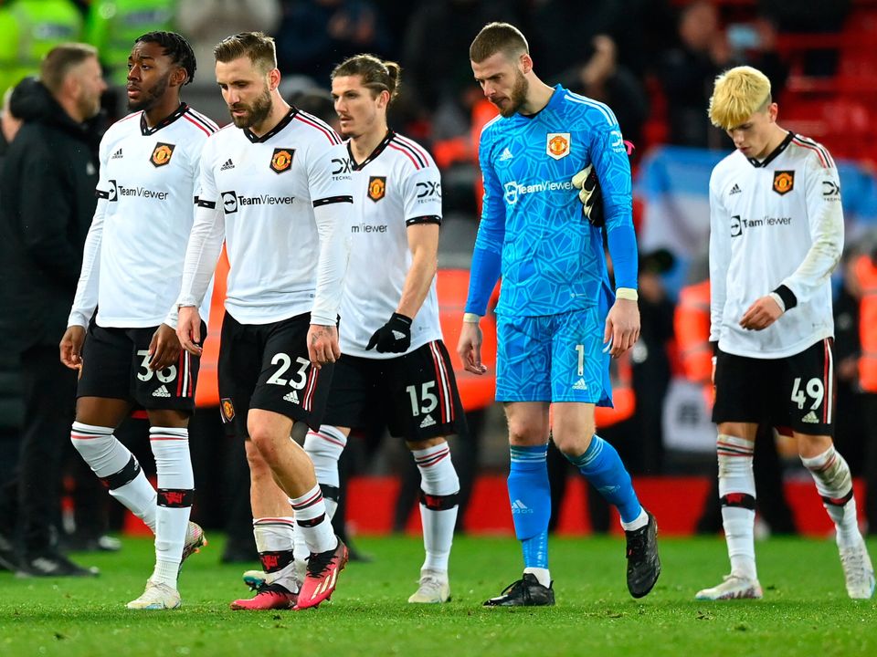 LIVERPOOL, ENGLAND - MARCH 05: Players of Manchester United look dejected as they leave the field, after being defeated 7-0 during the Premier League match between Liverpool FC and Manchester United at Anfield on March 05, 2023 in Liverpool, England. (Photo by Michael Regan/Getty Images)