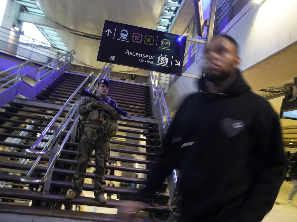 A soldier patrols at the Gare du Nord train station, Wednesday, Jan. 11, 2023 in Paris. French media are reporting that people have been stabbed at a Paris train station and the interior minister says several people were injured before police "rapidly neutralized" the attacker. (AP Photo/Michel Euler)