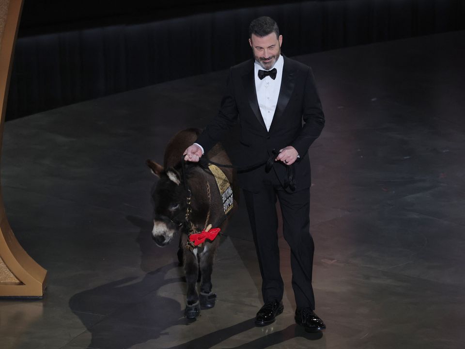Host Jimmy Kimmel with 'Jenny the donkey' during the Oscars ceremony (Photo: Reuters/Carlos Barria)